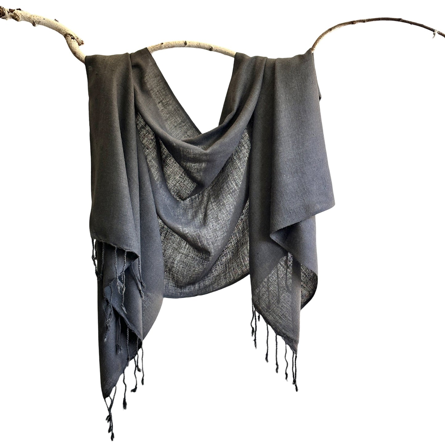 Grey silk scarf draped over a branch.