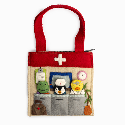 A healthcare theme puppet bag with a doctor's office scene and finger puppets of a duck doctor, a nurse penguin, and a frog patient with a bandaged arm.