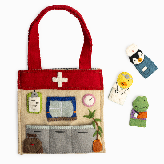 A healthcare theme puppet bag with a doctor's office scene and finger puppets of a duck doctor, a nurse penguin, and a frog patient with a bandaged arm.