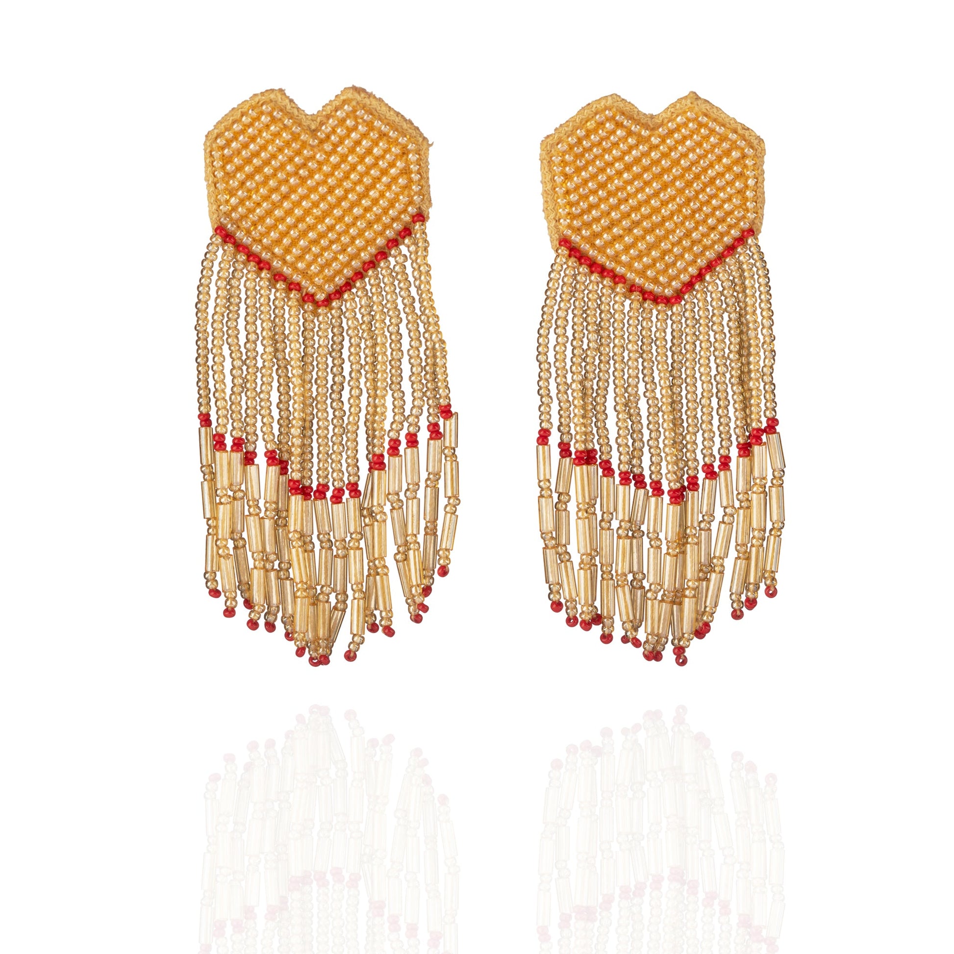 Pair of white and gold glass bead earrings with red accents.