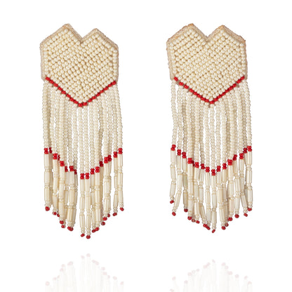 Pair of white and gold glass bead earrings with red accents.