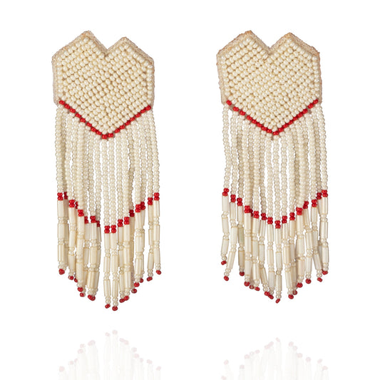 Pair of white and gold glass bead earrings with red accents.