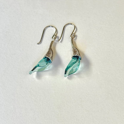 Pair of blue twisted glass petal earrings with silver findings.