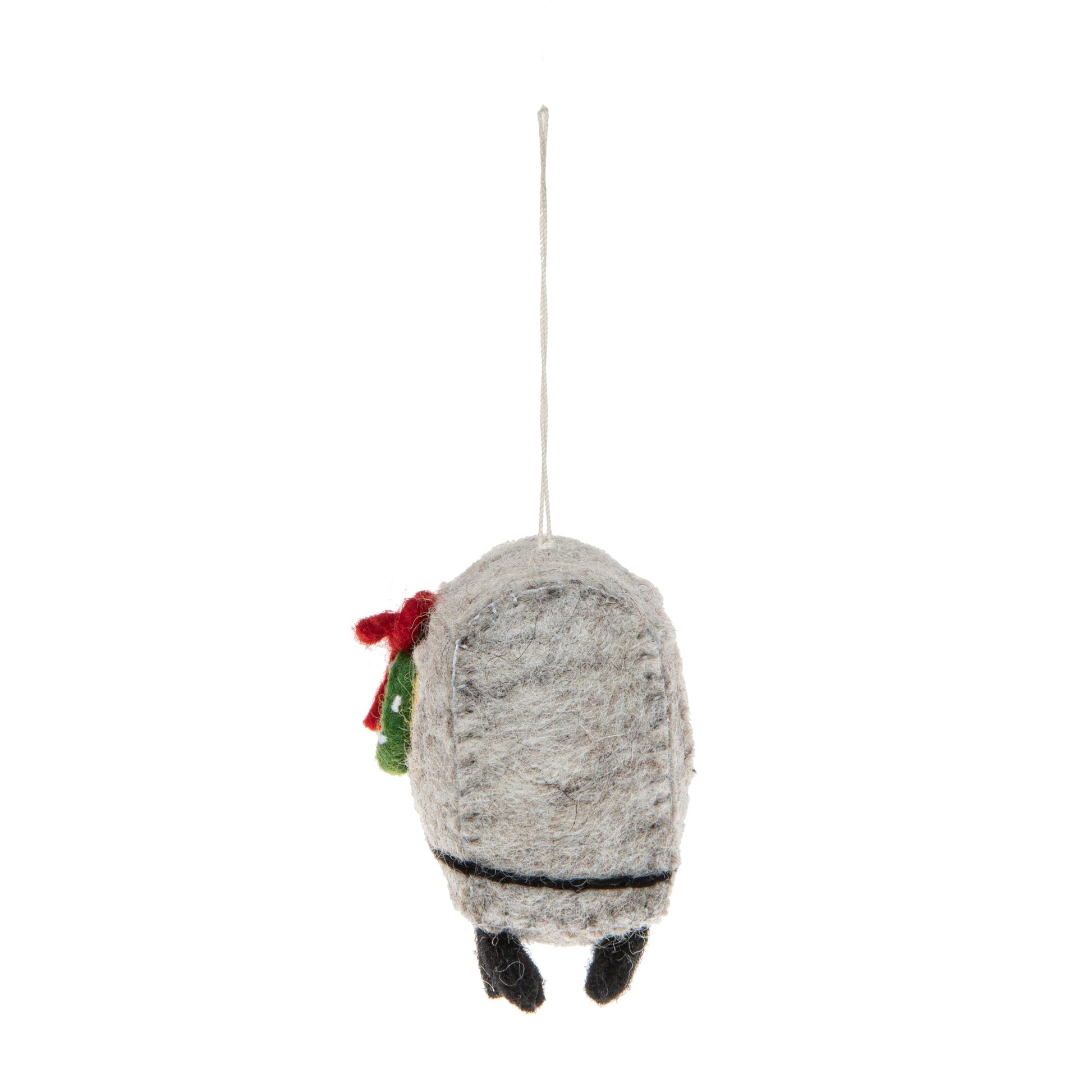 Back view of a felt ornament of a New York City subway car with a Christmas wreath on it.