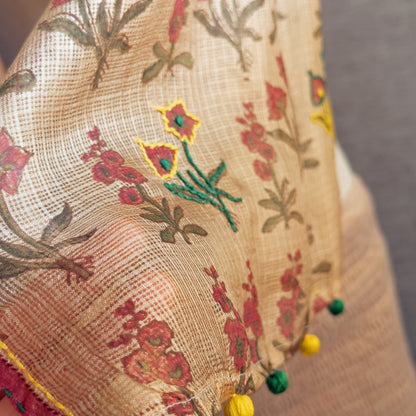 Closeup of natural died silk stole with pink, green, yellow flowers.