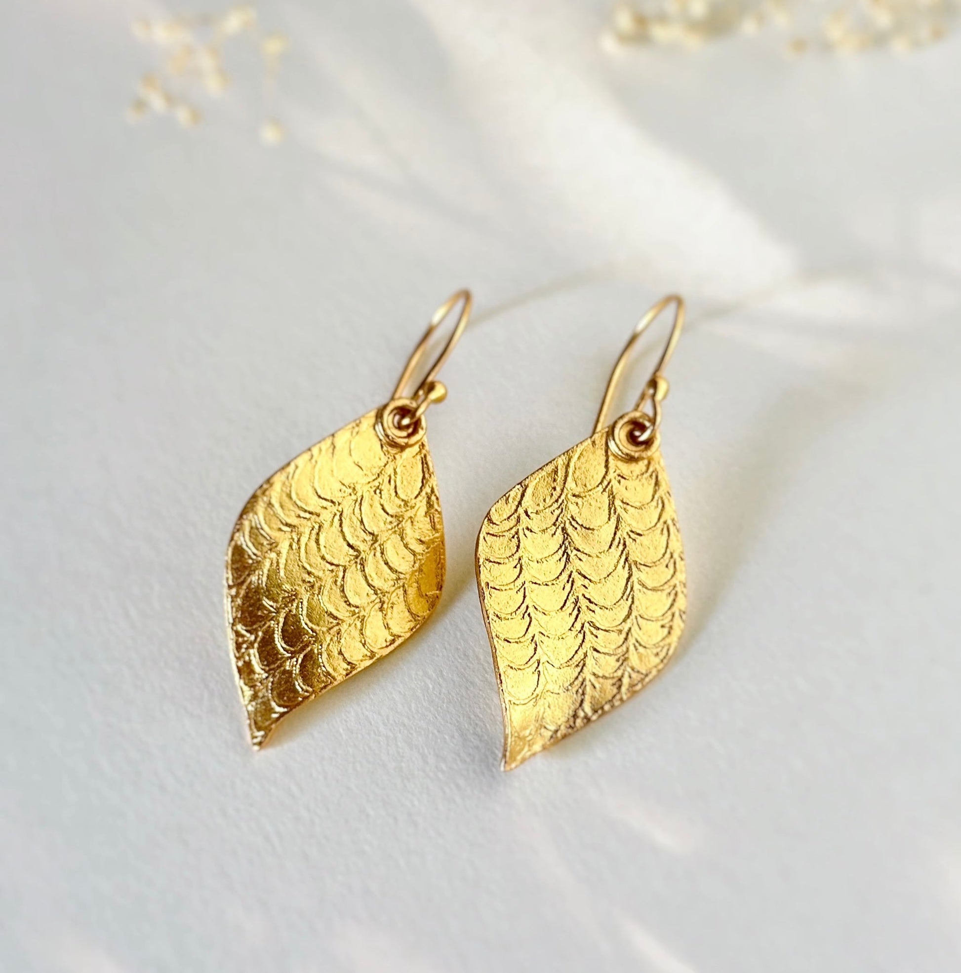 Pair of gold leaf earrings.