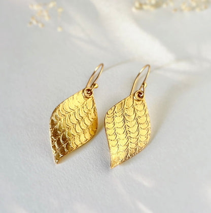 Pair of gold leaf earrings.