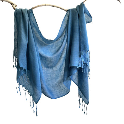 Blue silk scarf draped over branch.