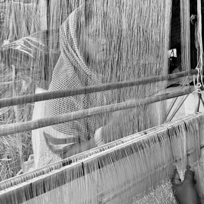 Handloom set up for weaving linen and gold zari scarves in a workshop in rural West Bengal.