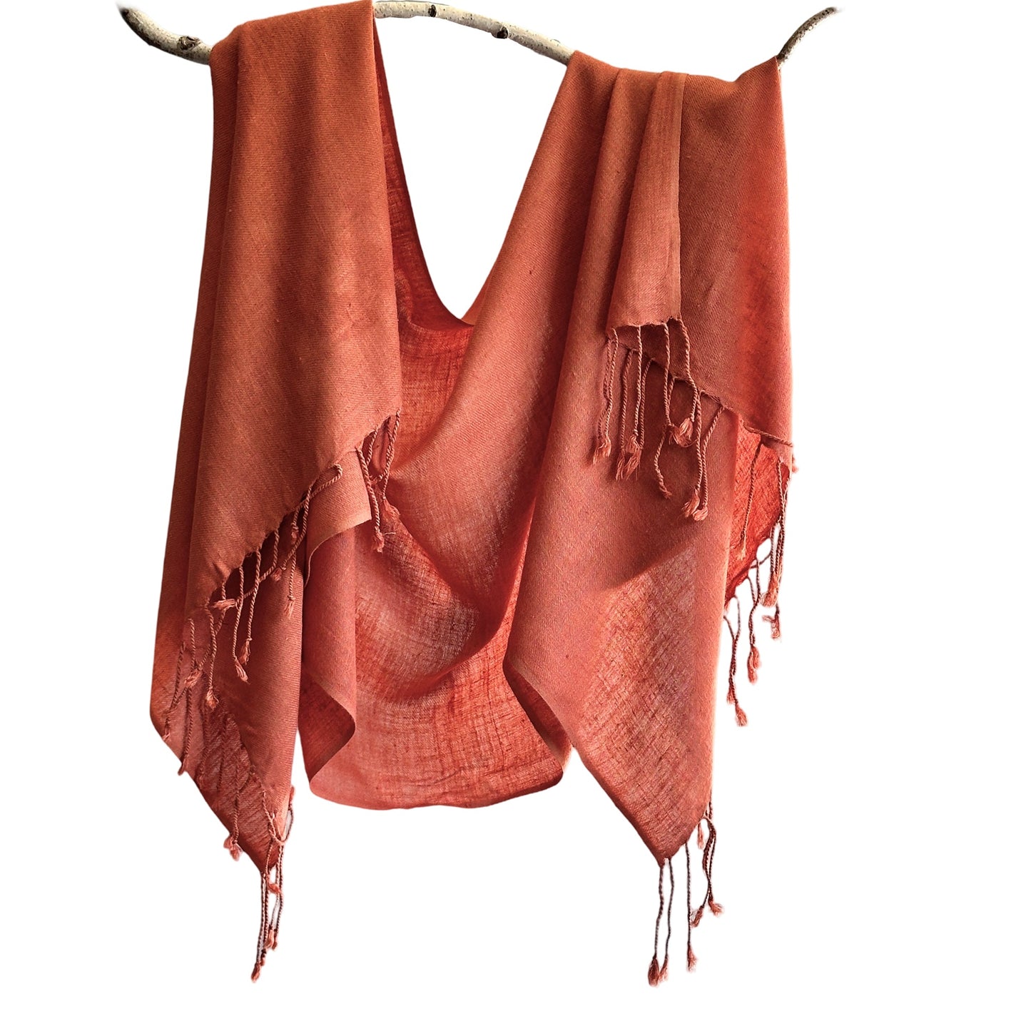 Orange silk scarf draped over branch.
