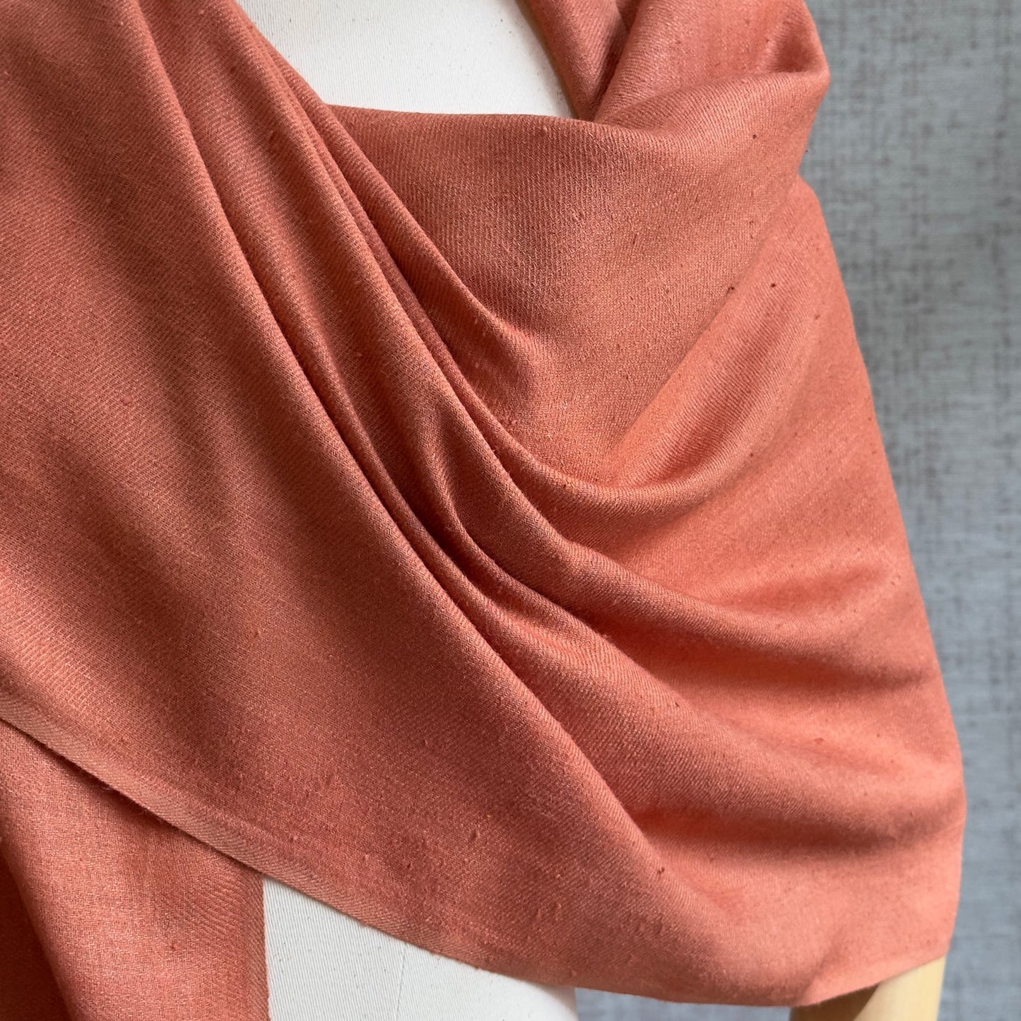 Closeup of orange silk scarf.