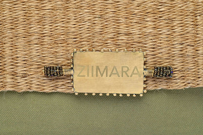 Closeup of sisal details on large green bag.