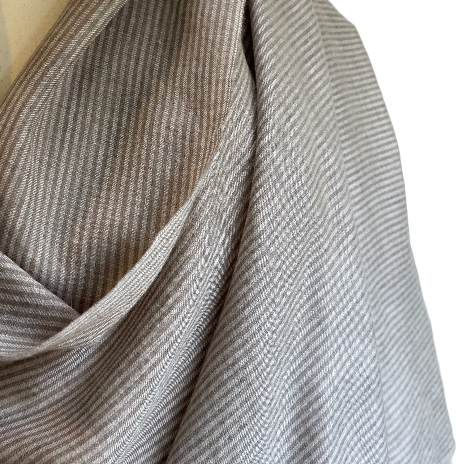Closeup of taupe and brown striped scarf