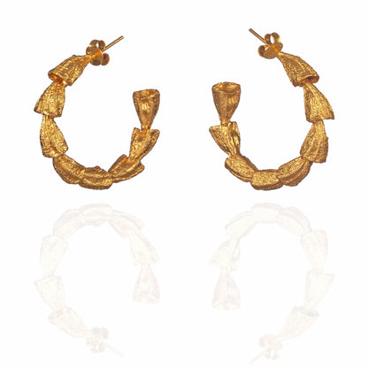 Pair of gold hoop earrings.