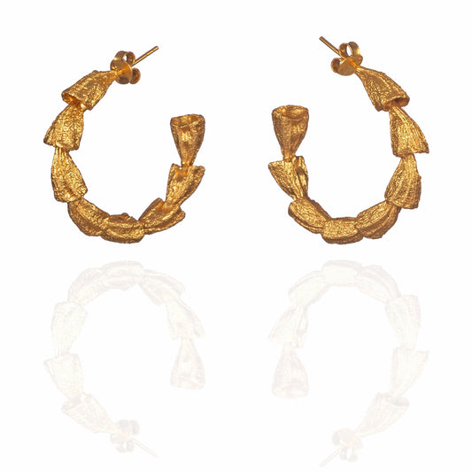Pair of gold hoop earrings.