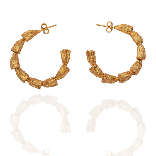 Pair of gold hoop earrings.