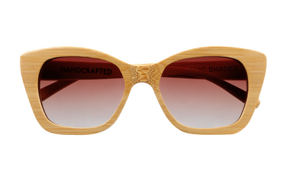 Front view of natural tan bamboo sunglasses with angular design and gradient amber tinted lenses.