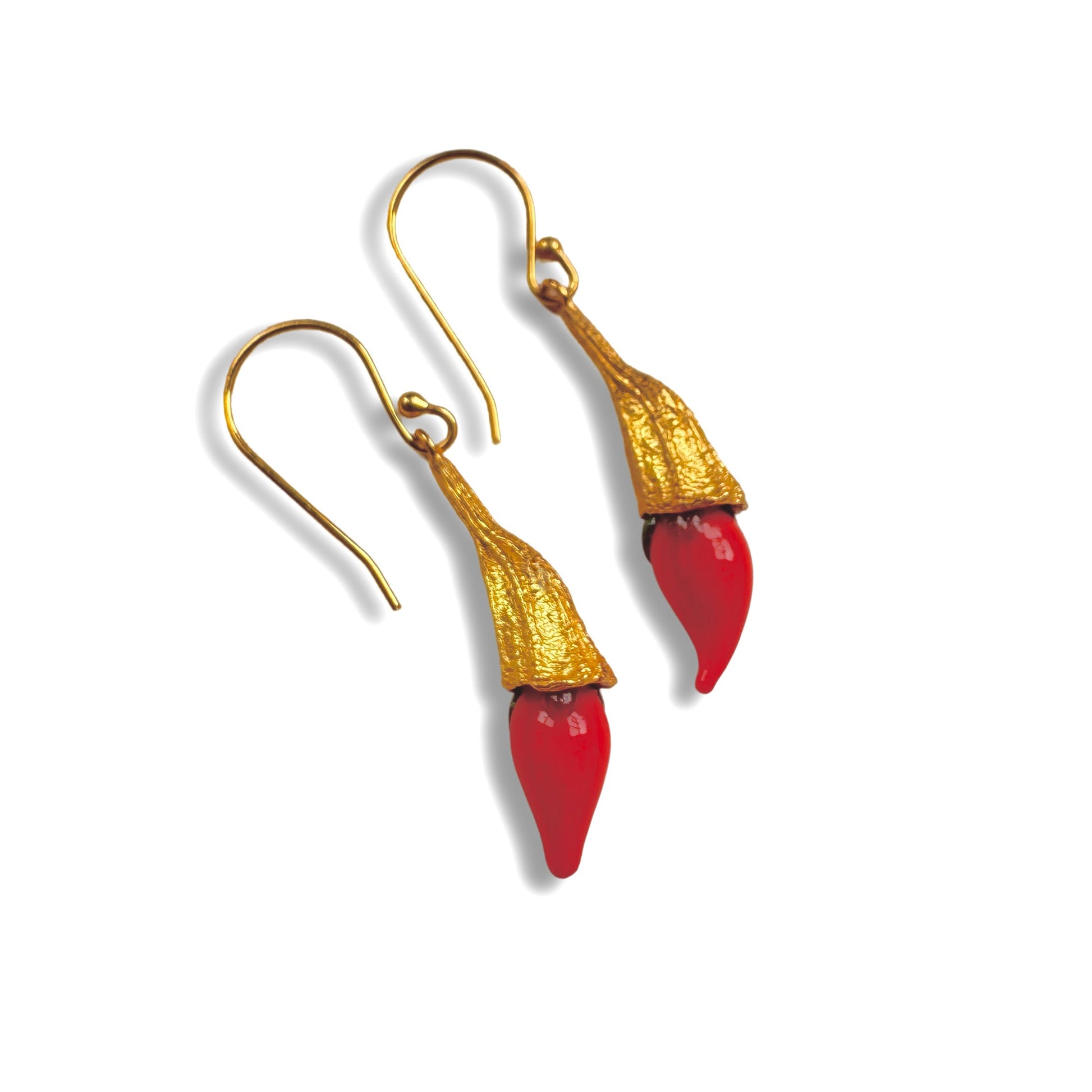 Red chili pod and gold hanging earrings.