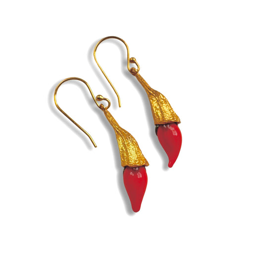 Red chili pod and gold hanging earrings.