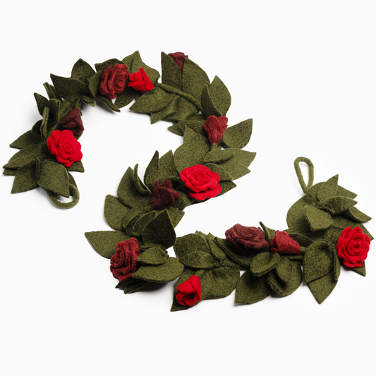 Felted garland of red roses and green leaves.