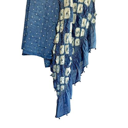 Close-up of dark blue indigo-dyed mulberry silk sari showing white diamond shibori fold-resist pattern on the pallu.