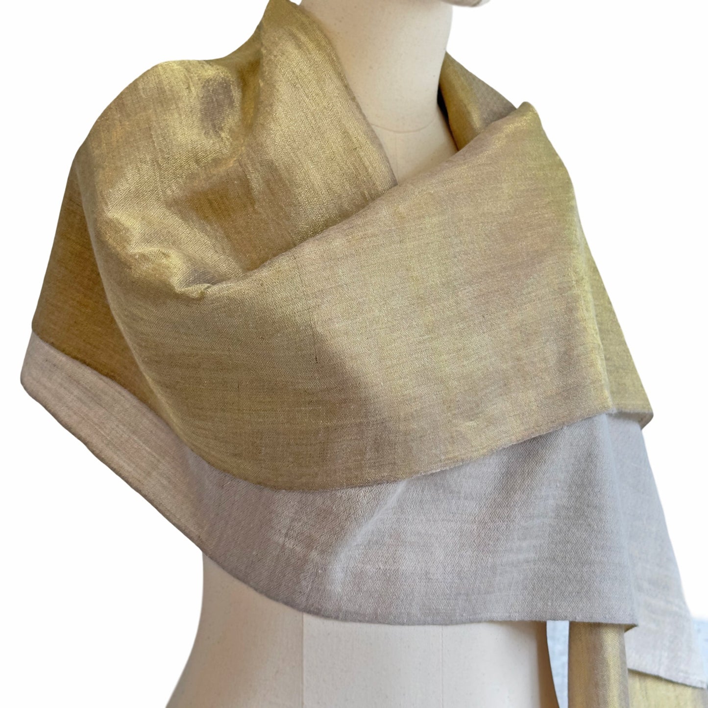 Gold and taupe wrap on a mannikin.