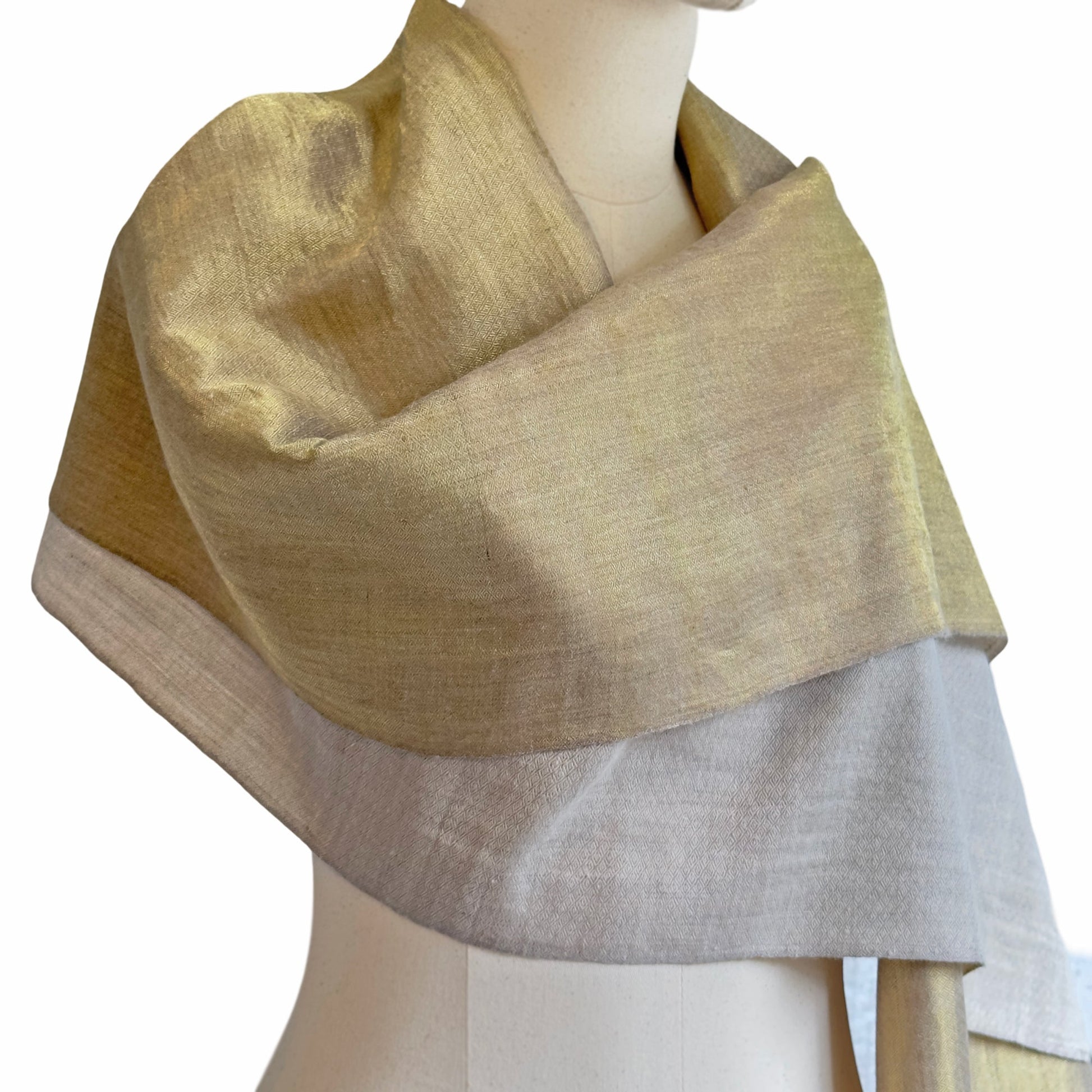 Gold and taupe wrap on a mannikin.
