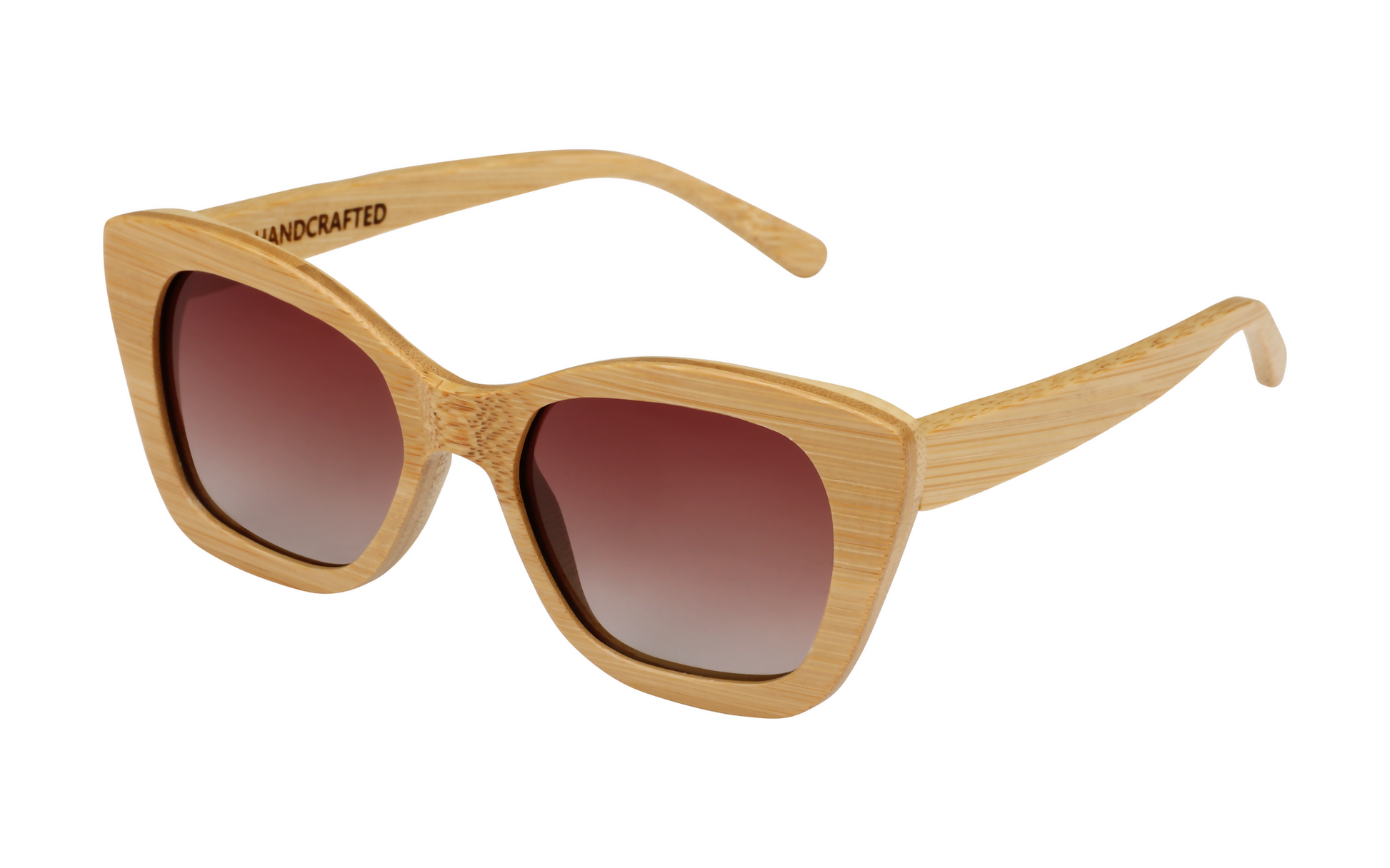Diagonal view of natural tan bamboo sunglasses with angular design and gradient amber tinted lenses.