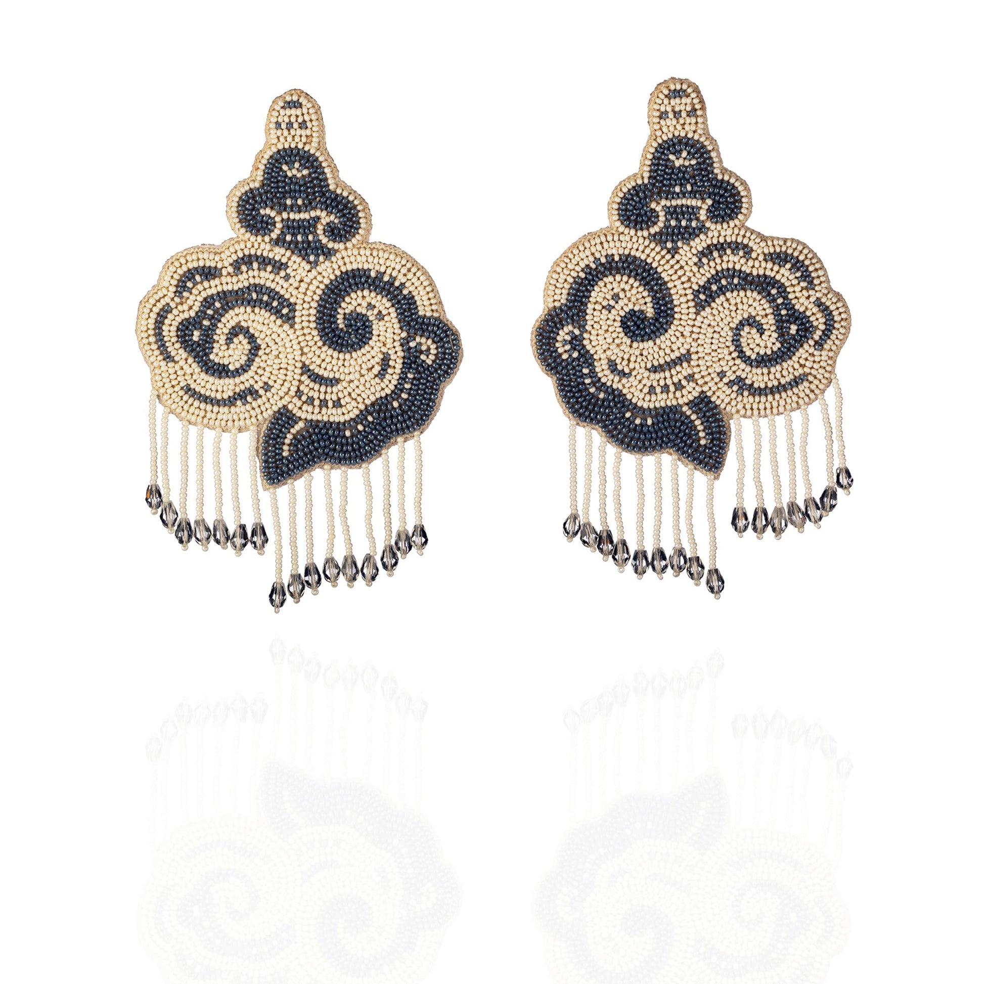 Pair of white and black cloud earrings with tassels.