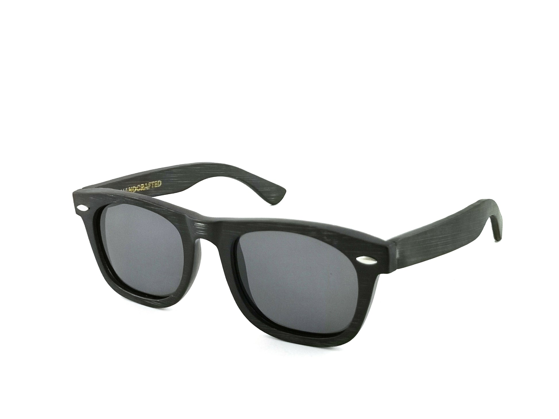 Diagonal view of Bamboo wayfarer style sunglasses in black with black lenses.