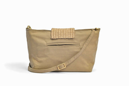 Back view of sandstone green bag with pocket and cloth strap.